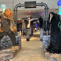 Spirit Halloween - Left: 7ft Possessed Pumpkin animatronic ($329.99) Right: 6ft Lord Raven animatronic ($299.99)