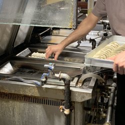 Photo of 原宿餃子樓 - Shibuya, 13, JP. How they fry the dumplings- fun to watch