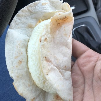 Dunkin' -  a person holding a burrito in their hand - Donuts Near Me - Willoughby Hills, Ohio