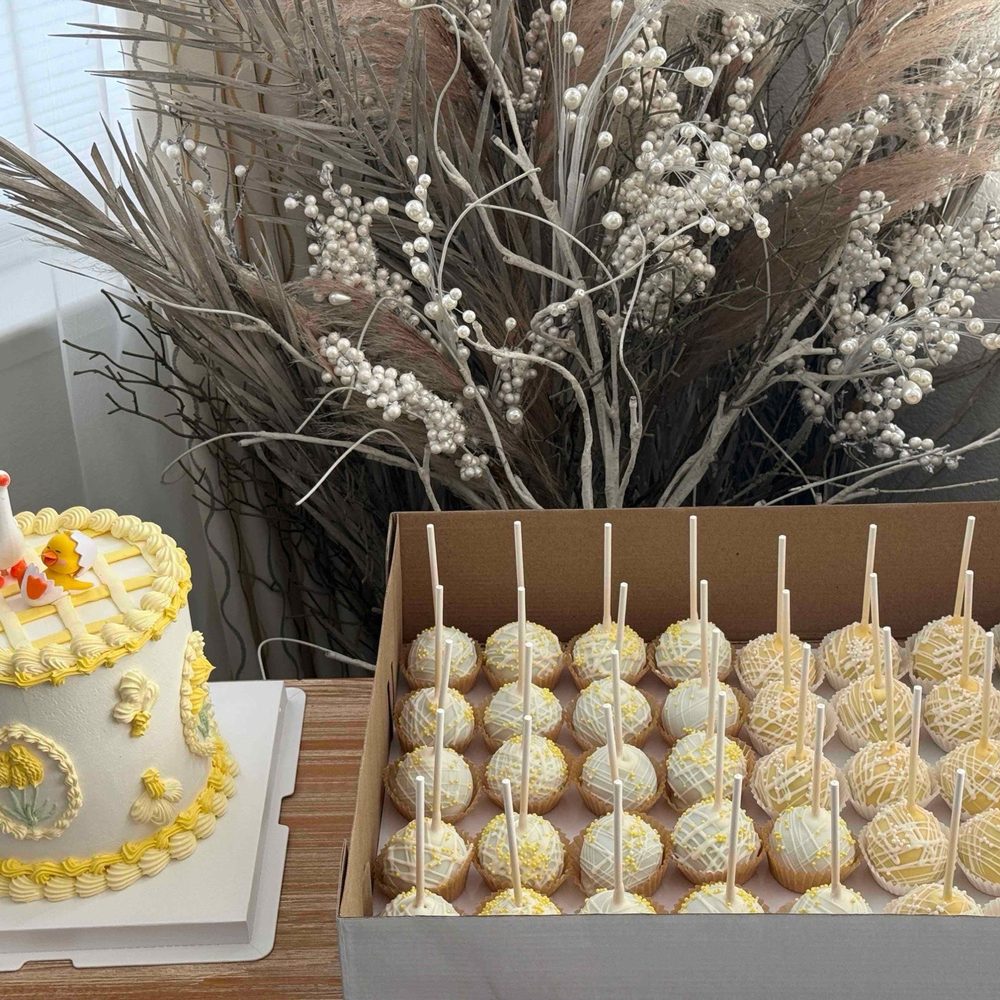 Cake along with birthday cake and chocolate flavored cake pops.