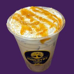 Industry Coffee - Dutch apple pie latte with whipped foam and caramel drizzle
