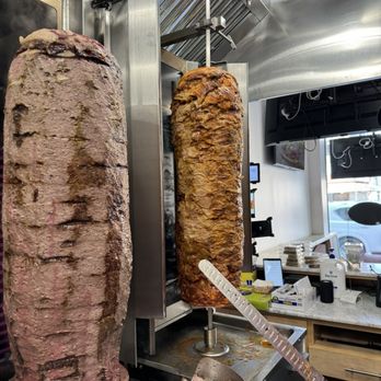Gyro Express - a large kebab being cooked in a commercial kitchen - Desserts Near Me - Brooklyn, New York