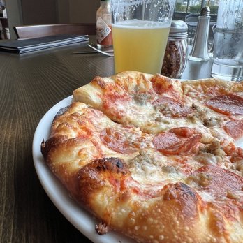 Lombardi's Italian Restaurant - Sausage and pepperoni with an IPA in the background - Italian Near Me - Bellingham, Washington