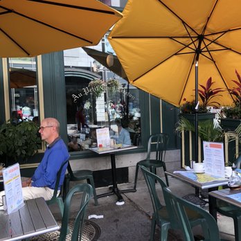 Au Petit Coin Breton - a man sitting at an outdoor restaurant - Creperies Near Me - Quebec City, Quebec Au Petit Coin Breton - a man sitting at an outdoor restaurant - Creperies Near Me - Quebec City, Quebec