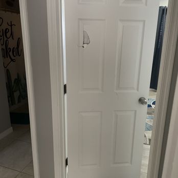 Old Reliable Construction - a white door with a black handle - General Contractors Near Me