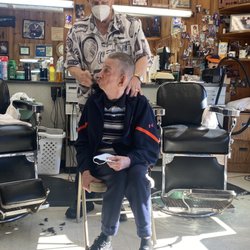 Wayside Barber Shop - An handicapped young man. Bobby did five handicapped men for free this morning. He has been doing this every week/month for 34 years.