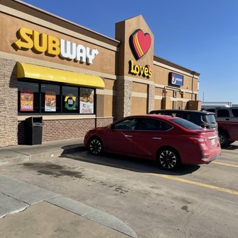 Love's Travel Stop - a red car parked in front of a subway love's - Gas Stations Near Me - Tonkawa, Oklahoma