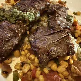 Confisco Grille & Backwater Bar - Chimichurri steak on a bed of rice , beans , and corn salsa - Bars Near Me - Orlando, Florida Confisco Grille & Backwater Bar - Chimichurri steak on a bed of rice , beans , and corn salsa - Bars Near Me - Orlando, Florida