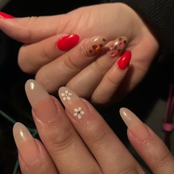 True Nails & Spa - My nails with the white flowers  The red nails are my friend's - Nail Salons Near Me - Ontario, California