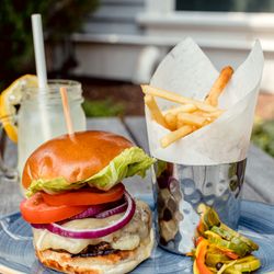 Town Meeting Bistro - Our Hastings Burger with Aged Cheddar, Lettuce, Tomato, Onion, and House-made Pickles.