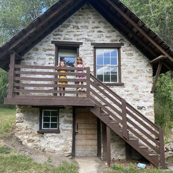 Huber Grove - The girls peeking over the second story balcony of the creamery. - Landmarks & Historical Buildings Near Me Huber Grove - The girls peeking over the second story balcony of the creamery. - Landmarks & Historical Buildings Near Me