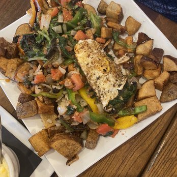 Rascals Tavern - Hash of the day with hot honey fried chicken - Bars Near Me - Greensboro, North Carolina