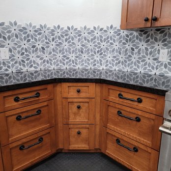 Precision Cabinetry - a kitchen with wooden cabinets and black countertops - General Contractors Near Me - Escondido, California Precision Cabinetry - a kitchen with wooden cabinets and black countertops - General Contractors Near Me - Escondido, California