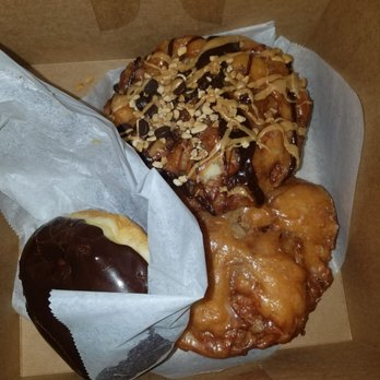 Voodoo Doughnut - Chocolate, apple fritter, peanut butter and chocolate apple fritter - Donuts Near Me - Denver, Colorado Voodoo Doughnut - Chocolate, apple fritter, peanut butter and chocolate apple fritter - Donuts Near Me - Denver, Colorado