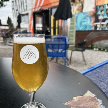Ratio Beerworks - a glass of beer on a table - Breweries Near Me - Denver, Colorado Ratio Beerworks - a glass of beer on a table - Breweries Near Me - Denver, Colorado