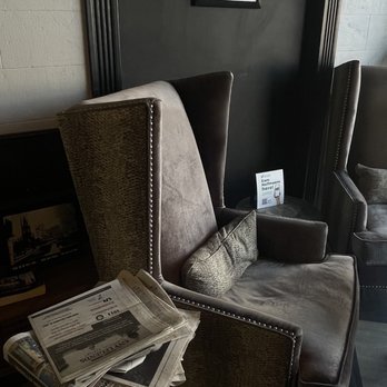 Character Coffee - a chair with newspaper on it - Coffee & Tea Near Me - Utica, New York Character Coffee - a chair with newspaper on it - Coffee & Tea Near Me - Utica, New York
