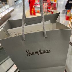 Neiman Marcus - Pickup on the upper level - very hard to find but it's in the back area - look for the restroom signs. Go there.