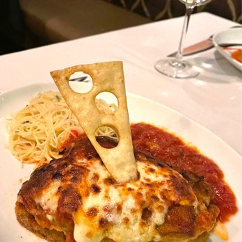 Spain Restaurant - Chicken parm topped with eggplant parm topped with chicken parm again and finished off the a slice of prosciutto. Amazing! - Spanish Near Me - Cranston, Rhode Island