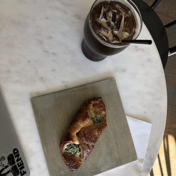 Americano Lounge - Iced americano and spinach croissant sandwich. - Coffee & Tea Near Me - Nashville, Tennessee Americano Lounge - Iced americano and spinach croissant sandwich. - Coffee & Tea Near Me - Nashville, Tennessee