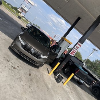 Love's Travel Stop - two cars parked at a gas station - Convenience Stores Near Me - Gallup, New Mexico