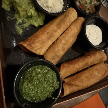 Tierra y Mar - Chicken taquitos with toppings on the side - Mexican Near Me - Valley Center, California Tierra y Mar - Chicken taquitos with toppings on the side - Mexican Near Me - Valley Center, California