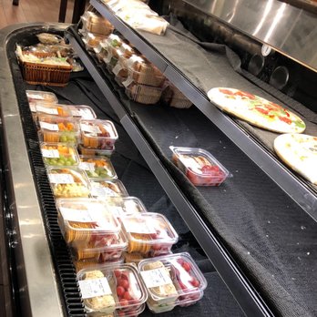 The Fresh Market - a variety of food items on the conveyor belt - Grocery Near Me - Towson, Maryland