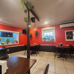 a dining room with red walls a dining room with red walls