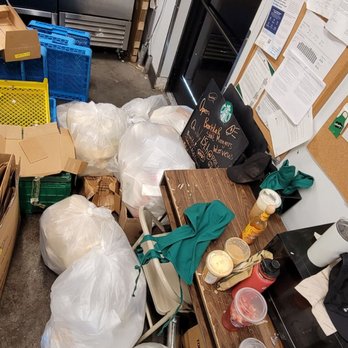 Starbucks - Trash stays piled up and back next to food accessories, refrigerators, and ice bin - Coffee & Tea Near Me - Charlotte, North Carolina