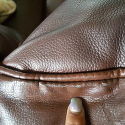 Butterworth's Furniture - Leather splitting like dry rotten. All over sofa