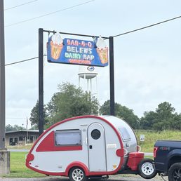 a trailer parked in front of a dairy bar