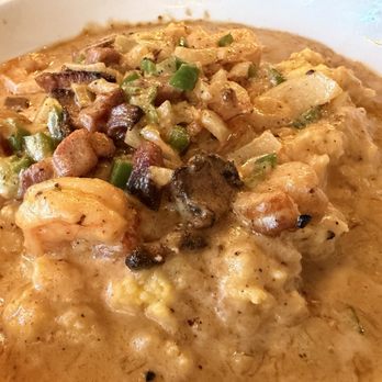 Churchill's - Shrimp & Grits - Local Georgia wild shrimp with tasso ham, bell peppers, cremini mushrooms, and caramelized onions - Pubs Near Me - Savannah, Georgia Churchill's - Shrimp & Grits - Local Georgia wild shrimp with tasso ham, bell peppers, cremini mushrooms, and caramelized onions - Pubs Near Me - Savannah, Georgia