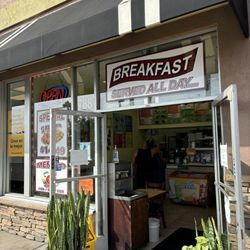 This is the outside storefront breakfast is served all day long