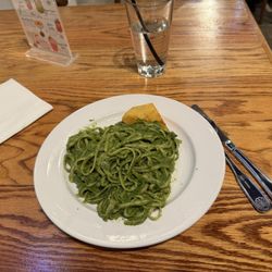 Linguini in a pesto sauce with a fried potato