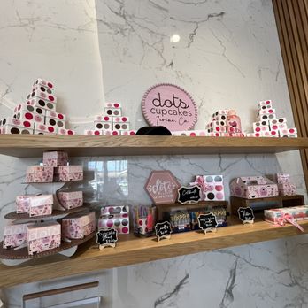 Dots Cupcakes - a display of cupcakes on a shelf - Cupcakes Near Me - Irvine, California