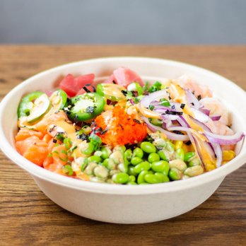 Domoishi - a bowl of food on a wooden table - Poke Near Me - Norfolk, Virginia Domoishi - a bowl of food on a wooden table - Poke Near Me - Norfolk, Virginia