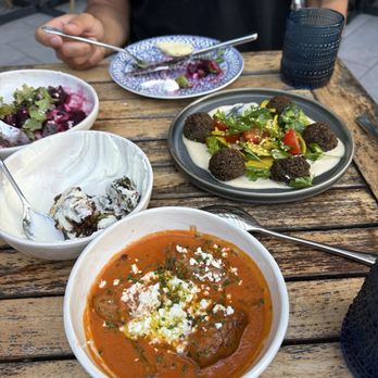 Zaytinya - Falafel and half eaten bushel sprouts. In front is the soutzoukakia - Greek Near Me - Culver City, California Zaytinya - Falafel and half eaten bushel sprouts. In front is the soutzoukakia - Greek Near Me - Culver City, California