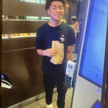 McDonald's - a man holding a bag of food - Fast Food Near Me - Port Saint Lucie, Florida McDonald's - a man holding a bag of food - Fast Food Near Me - Port Saint Lucie, Florida