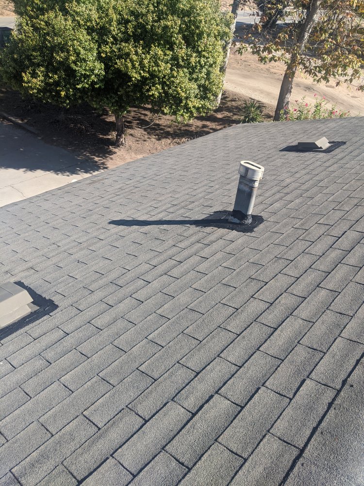 Slide of Tom's Roofing Services