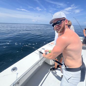100 Proof Charters - Catching an amberjack - Boat Charters Near Me - Destin, Florida