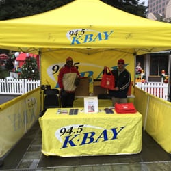 KBAY 94.5 FM - K-Bay booth at Christmas in the Park, San Jose on Sunday, December 13, 2015 with two very hip staffers working their booth!