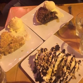 Pie Bar - Chocolate Pecan, Apple, and peanut butter chocolate. My suggestion would he the apple with the ice cream! Can't go wrong with A la mode! - Cocktail Bars Near Me - Seattle, Washington