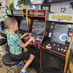 Standard Haircuts - Enjoying some arcade games after our haircut.