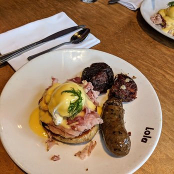 Lola - Egga Benedict with a side of maple pork sausage (both splitted in half) - Greek Near Me - Seattle, Washington