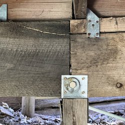 Sunland Inspection - Deck Inspection- Underneath the deck, a splice between two main support beams. Post size and beam bearing inadequate,improper hardware used.