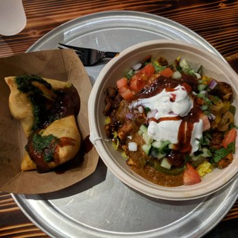 Naan-Tastic - Tumeric rice bowl with chicken tikka covered in slamin' marsala sauce. Side of veggie samosas, topped with the sweet tamarind sauce. - Indian Near Me - Rochester, New York Naan-Tastic - Tumeric rice bowl with chicken tikka covered in slamin' marsala sauce. Side of veggie samosas, topped with the sweet tamarind sauce. - Indian Near Me - Rochester, New York