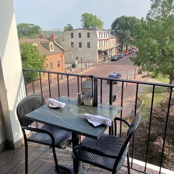 Lewis and Clark's - a table and chairs on a balcony - American Near Me - St Charles, Missouri