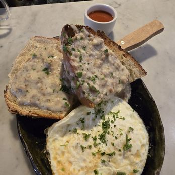 Ivy Café - The Lindbergh Tartine. Savory gravy over house made sourdough with two eggs! - Coffee & Tea Near Me - Clayton, Missouri Ivy Café - The Lindbergh Tartine. Savory gravy over house made sourdough with two eggs! - Coffee & Tea Near Me - Clayton, Missouri