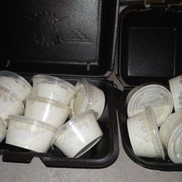 two open plastic containers filled with ice cream two open plastic containers filled with ice cream