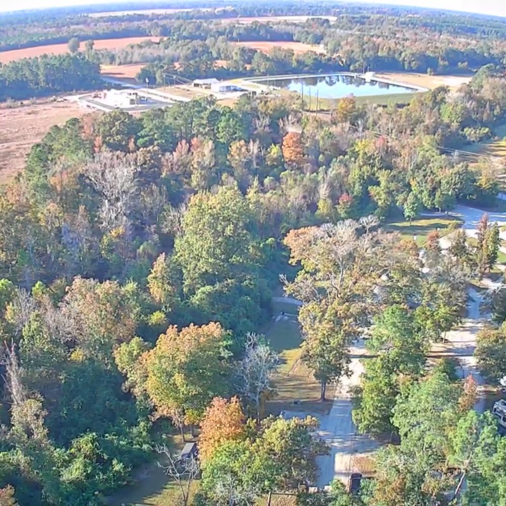 Magnolia Lane Campground - drone view from lake to the entrance - RV Parks Near Me - Pollocksville, North Carolina Magnolia Lane Campground - drone view from lake to the entrance - RV Parks Near Me - Pollocksville, North Carolina