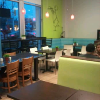 Shawarma Prince - a woman sitting at a table in a restaurant - Lebanese Near Me - Ottawa, Ontario Shawarma Prince - a woman sitting at a table in a restaurant - Lebanese Near Me - Ottawa, Ontario